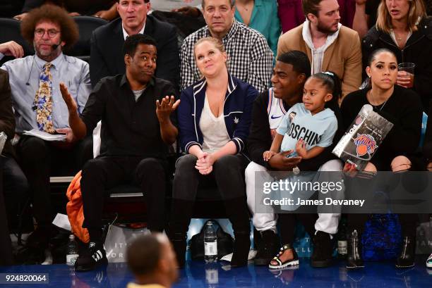 Chris Rock, Amy Schumer, Tracy Morgan, Maven Morgan and Megan Wollover attend the New York Knicks Vs Golden State Warriors game at Madison Square...