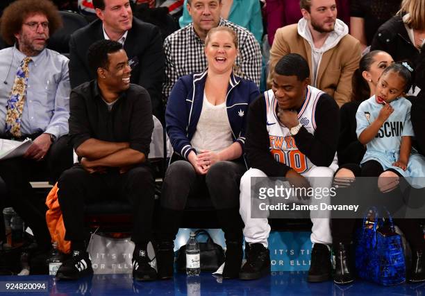Chris Rock, Amy Schumer, Tracy Morgan, Maven Morgan and Megan Wollover attend the New York Knicks Vs Golden State Warriors game at Madison Square...