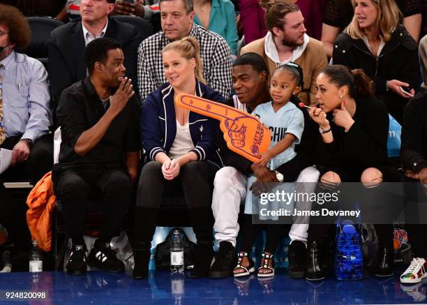 Chris Rock, Amy Schumer, Tracy Morgan, Maven Morgan and Megan Wollover attend the New York Knicks Vs Golden State Warriors game at Madison Square...