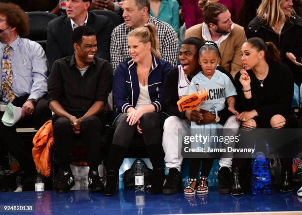 Chris Rock, Amy Schumer, Tracy Morgan, Maven Morgan and Megan Wollover attend the New York Knicks Vs Golden State Warriors game at Madison Square...