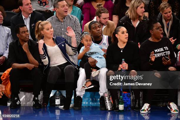 Chris Rock, Amy Schumer, Tracy Morgan, Maven Morgan, Megan Wollover and Leslie Jones attend the New York Knicks Vs Golden State Warriors game at...