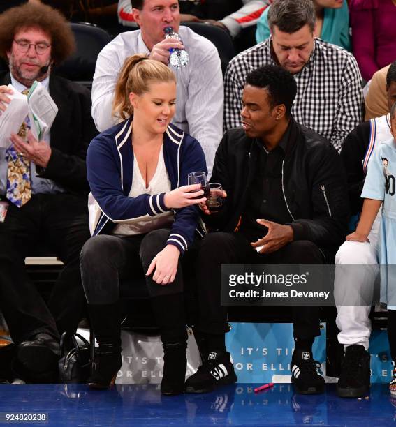 Amy Schumer and Chris Rock attend the New York Knicks Vs Golden State Warriors game at Madison Square Garden on February 26, 2018 in New York City.