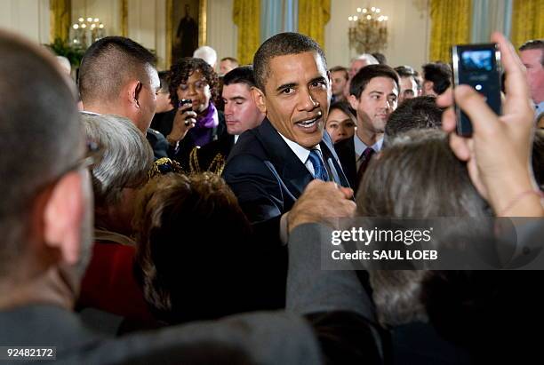 President Barack Obama greets guests after speaking in honor of the enactment of the Matthew Shepard and James Byrd, Jr., Hate Crimes Prevention Act...