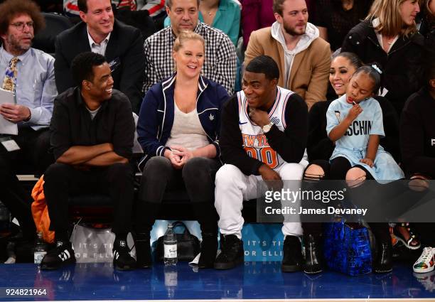 Chris Rock, Amy Schumer, Tracy Morgan, Maven Morgan and Megan Wollover attend the New York Knicks Vs Golden State Warriors game at Madison Square...