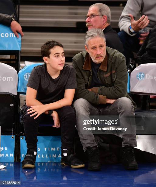 Nathan Stewart and Jon Stewart attend the New York Knicks Vs Golden State Warriors game at Madison Square Garden on February 26, 2018 in New York...