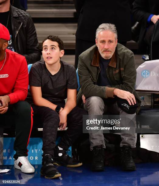 Nathan Stewart and Jon Stewart attend the New York Knicks Vs Golden State Warriors game at Madison Square Garden on February 26, 2018 in New York...