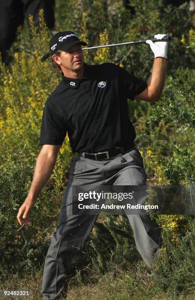 Retief Goosen of South Africa hits from the rough on the 5th hole during Day One of the Group Stage of the Volvo World Match Play Championship at...