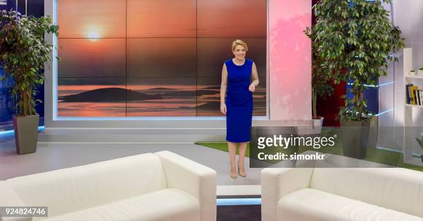 female talk show host giving introductory speech - television host stock pictures, royalty-free photos & images