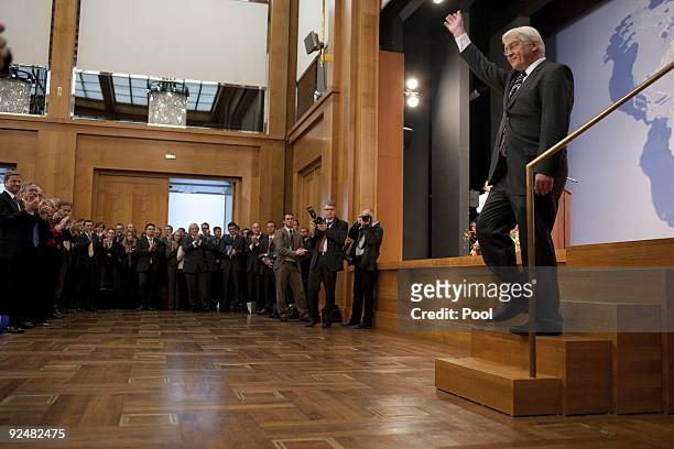 The former German Foreign Minister Frank-Walter Steinmeier waves to the audience after the hand over to his successor Guido Westerwelle at The...