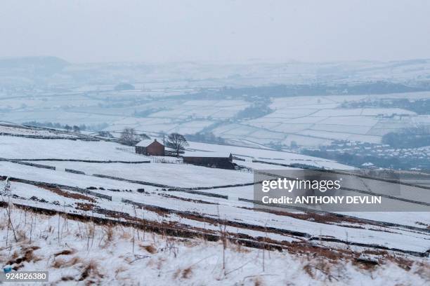 Snow covers the moors in the Peak District in northern England, on February 27, 2018 as icey temperatures persisted across Britain. A blast of...