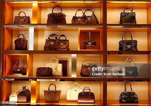 Louis Vuitton bags sit on display at the first anniversary of the News  Photo - Getty Images
