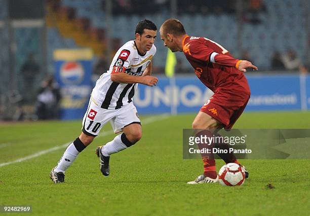 Antonio Di Natale of Udinese Calcio competes with Daniele De Rossi of AS Roma during the Serie A match Udinese Calcio and AS Roma at Stadio Friuli on...