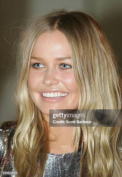 Lara Bingle poses for a photograph as she arrives for the first anniversary of the Louis Vuitton Collins Street store on October 29, 2009 in...