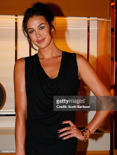 Model Megan Gale poses for a photograph as she arrives for the first anniversary of the Louis Vuitton Collins Street store on October 29, 2009 in...