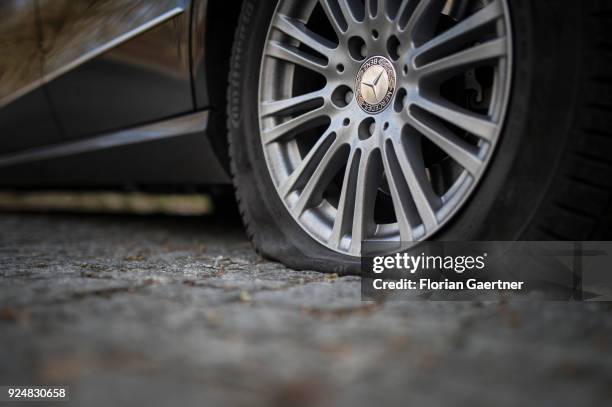 Car of Mercedes with its flat tire is pictured on February 25, 2018 in Berlin, Germany.