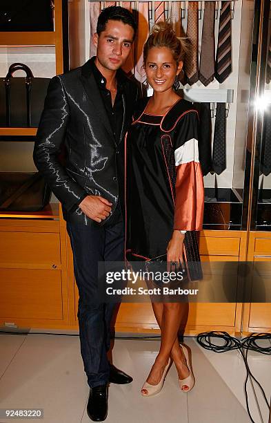Lewis Romano and Lillian Romano pose for a photograph as they arrive for the first anniversary of the Louis Vuitton Collins Street store on October...