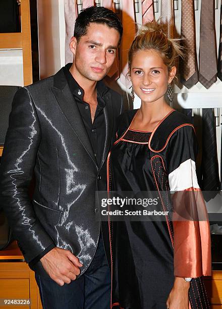 Lewis Romano and Lillian Romano pose for a photograph as they arrive for the first anniversary of the Louis Vuitton Collins Street store on October...