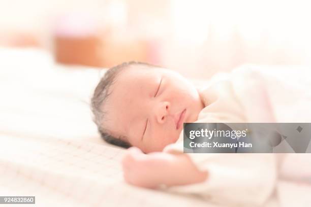 sleeping newborn baby girl. first day - its a girl kort fras bildbanksfoton och bilder