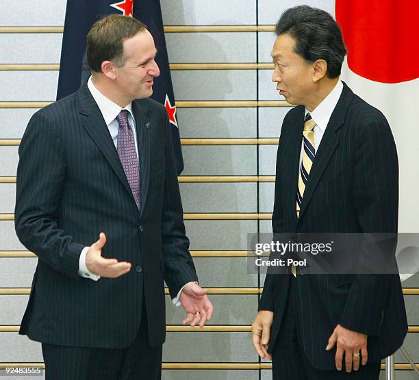 Prime Minister of New Zealand John Key chats with Japanese counterpart Yukio Hatoyama prior to their meeting at the latter's official residence on...