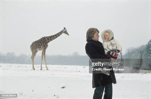 French singer Claude François with his son Claude Francois Junior at Thoiry's zoo, 4th January 1971
