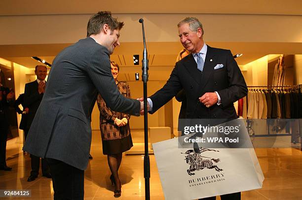 Prince Charles, The Prince of Wales is presented with a gabardine walking jacket by Burberry's creative director Christopher Bailey as the Prince...