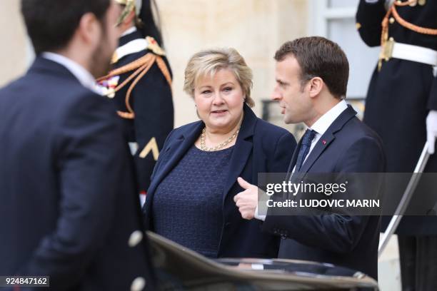 French president Emmanuel Macron accompanies Norwegian Prime Minister Erna Solberg leaving the Elysee presidential Palace after their meeting, on...