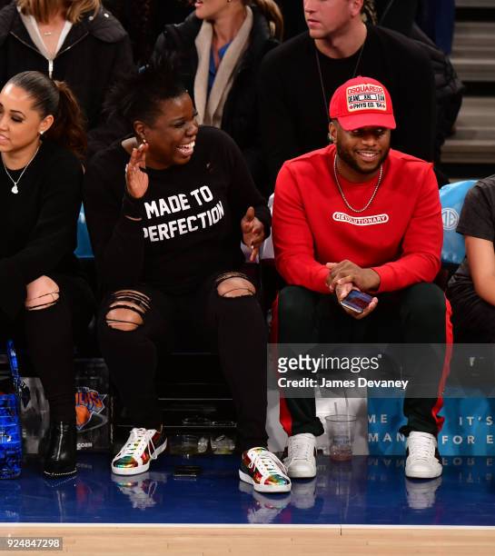 Leslie Jones and guest attend the New York Knicks Vs Golden State Warriors game at Madison Square Garden on February 26, 2018 in New York City.