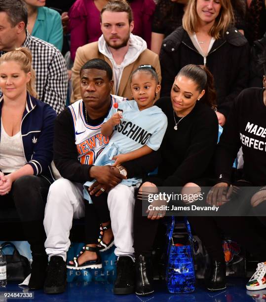 Tracy Morgan, Maven Morgan and Megan Wollover attend the New York Knicks Vs Golden State Warriors game at Madison Square Garden on February 26, 2018...