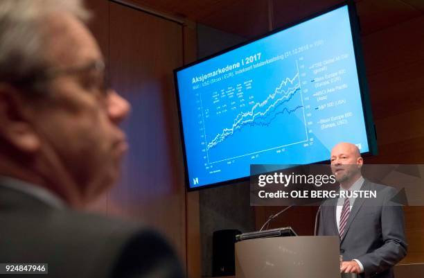 Oystein Olsen , Governor of the Central Bank of Norway , listens to Yngve Slyngstad , CEO of Norges Bank Investment Management , as he presents...