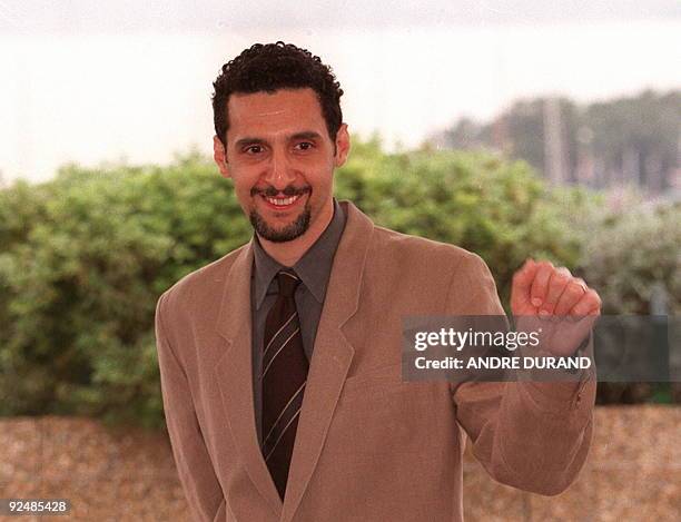 Actor John Turturro as he poses for photographers 13 May at the festivals Palace for the presentation of Francesco Rosi's film "La Tregua" adapted...