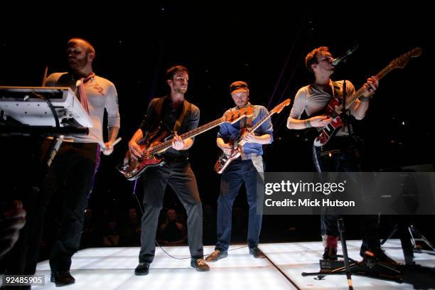 Will Champion, Guy Berryman, Jonny Buckland and Chris Martin of Coldplay perform on stage at the Manchester Evening News Arena on December 11th 2008...