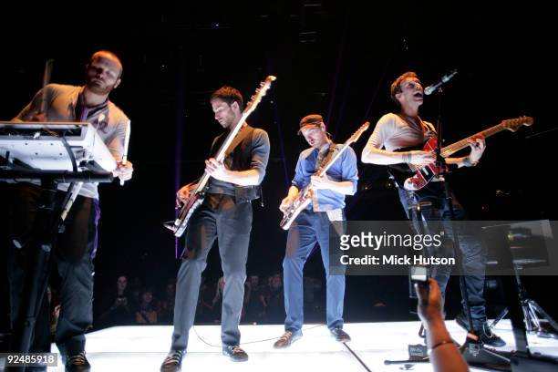 Will Champion , Guy Berryman, Jonny Buckland and Chris Martin of Coldplay perform on stage at the Manchester Evening News Arena on December 11th 2008...