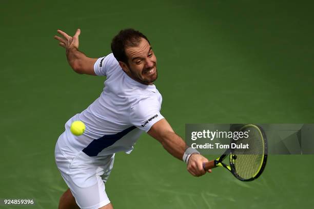 Richard Gasquet of France plays a backhand during his match against Borna Coric of Croatia on day two of the ATP Dubai Duty Free Tennis Championships...