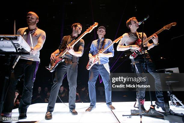 Will Champion , Guy Berryman, Jonny Buckland and Chris Martin of Coldplay perform on stage at the Manchester Evening News Arena on December 11th 2008...