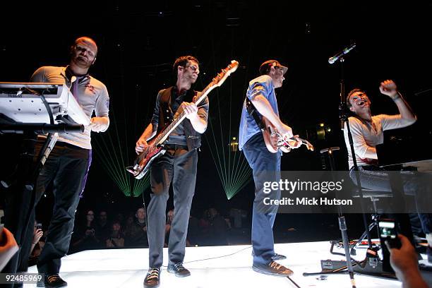 Will Champion, Guy Berryman, Jonny Buckland and Chris Martin of Coldplay perform on stage at the Manchester Evening News Arena on December 11th 2008...