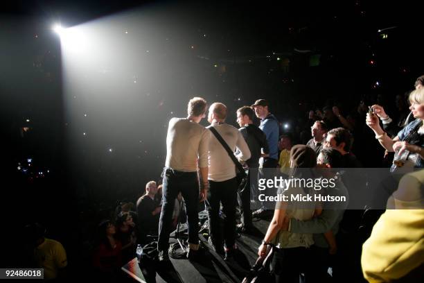 Chris Martin, Will Champion, Guy Berryman and Jonny Buckland of Coldplay perform on stage at the Manchester Evening News Arena on December 11th 2008...