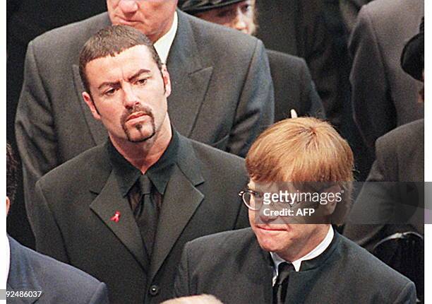 Pop stars George Michael and Elton John leave Westminster Abbey after the funeral service 06 September of Diana Princess of Wales. The Princess was...