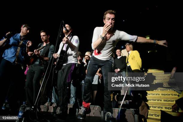 Jonny Buckland, Guy Berryman, Will Champion and Chris Martin of Coldplay perform on stage at the Manchester Evening News Arena on December 11th 2008...