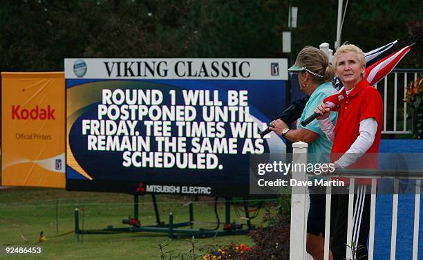 Lynda Woodall, of Meridian, Miss., and Karen Gibbs of Newton, Miss., watch weather and the sky after first round play was postponed in the Viking...