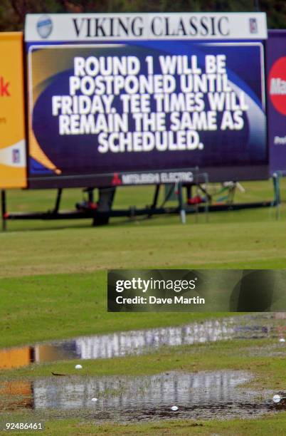 Golf balls on the driving range sit in water after first round play was postponed because of weather in the Viking Classic at the Annandale Golf Club...