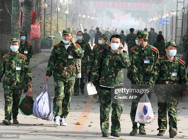 Chinese college students prepare to leave the military training camp in Beijing on October 29, 2009 after a student at Beijing's Beihang University,...