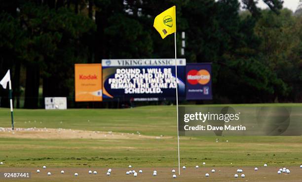 Range balls sit on a practice green after first round play was postponed because of weather in the Viking Classic at the Annandale Golf Club on...