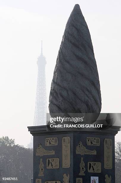 View taken on October 29, 2009 shows a menhir and a base with Asterix cartoon character on it, displayed Place de la Concorde in Paris, as part of...