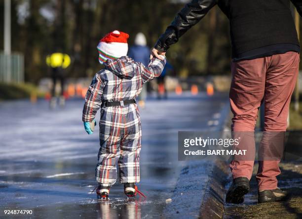 Child skates on the natural ice rink of the RijnIJssel and Thialf ice club in Arnhem on February 27, 2018. The ice floor is ready for a skating...