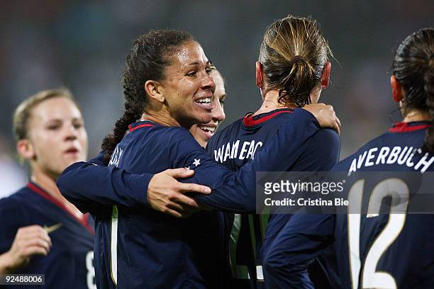 Abby Wambach of USA celebrates after scoring her team's first goal with team mates during the Women's International friendly match between Germany...