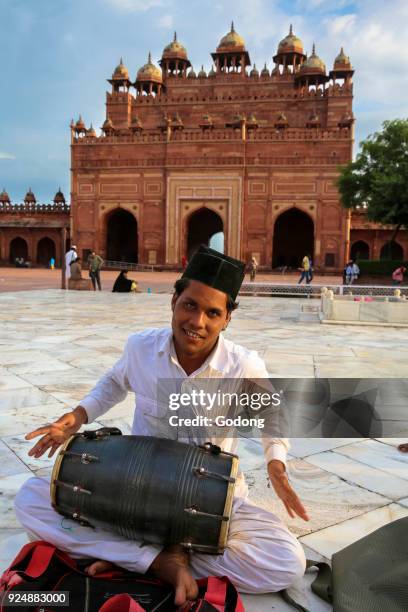 Qawali musician performing in the courtyard of Fatehpur Sikri Jama Masjid , Fatehpur Sikri. India.