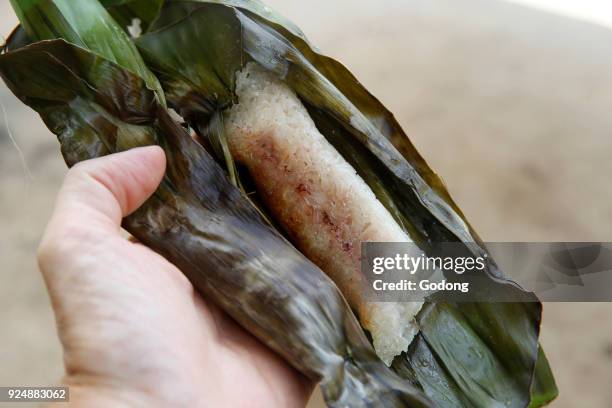 Fruit in sticky rice cooked in a banana leaf. Battambang. Cambodia.