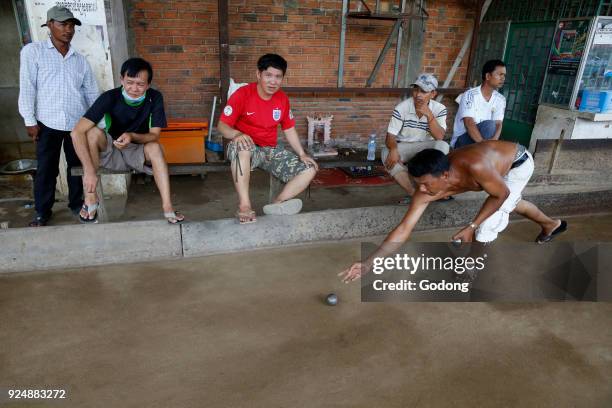 Khmers playing bowls in Battambang. Cambodia.