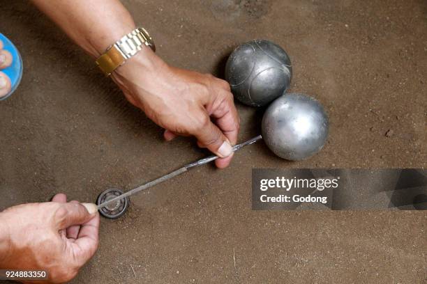 Khmers playing bowls in Battambang. Cambodia.