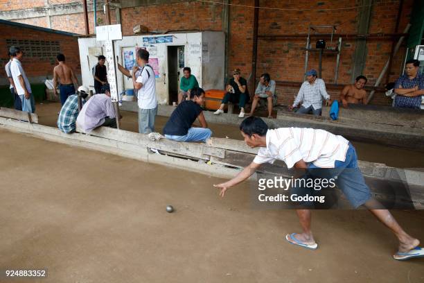 Khmers playing bowls in Battambang. Cambodia.